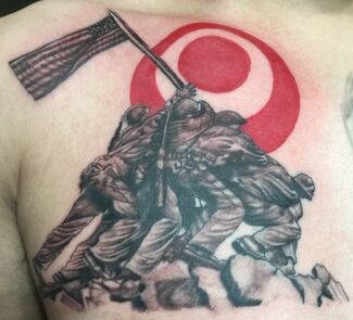 Tattoo depicting the raising of the flag at Iwo Jima with a red circle in the background.