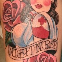Tattoo of a nurse wearing a cap with a red cross, surrounded by roses. Text reads