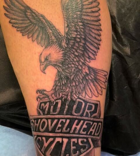 Eagle over a Motor Shovelhead Cycles banner tattoo