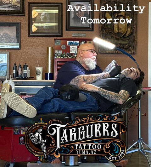 Brent tattooing a client in the studio