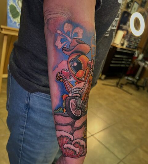 Color cartoon character forearm tattoo