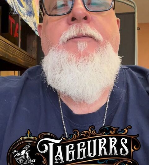 Brent Roman wearing a Taggurrs Tattoo shirt